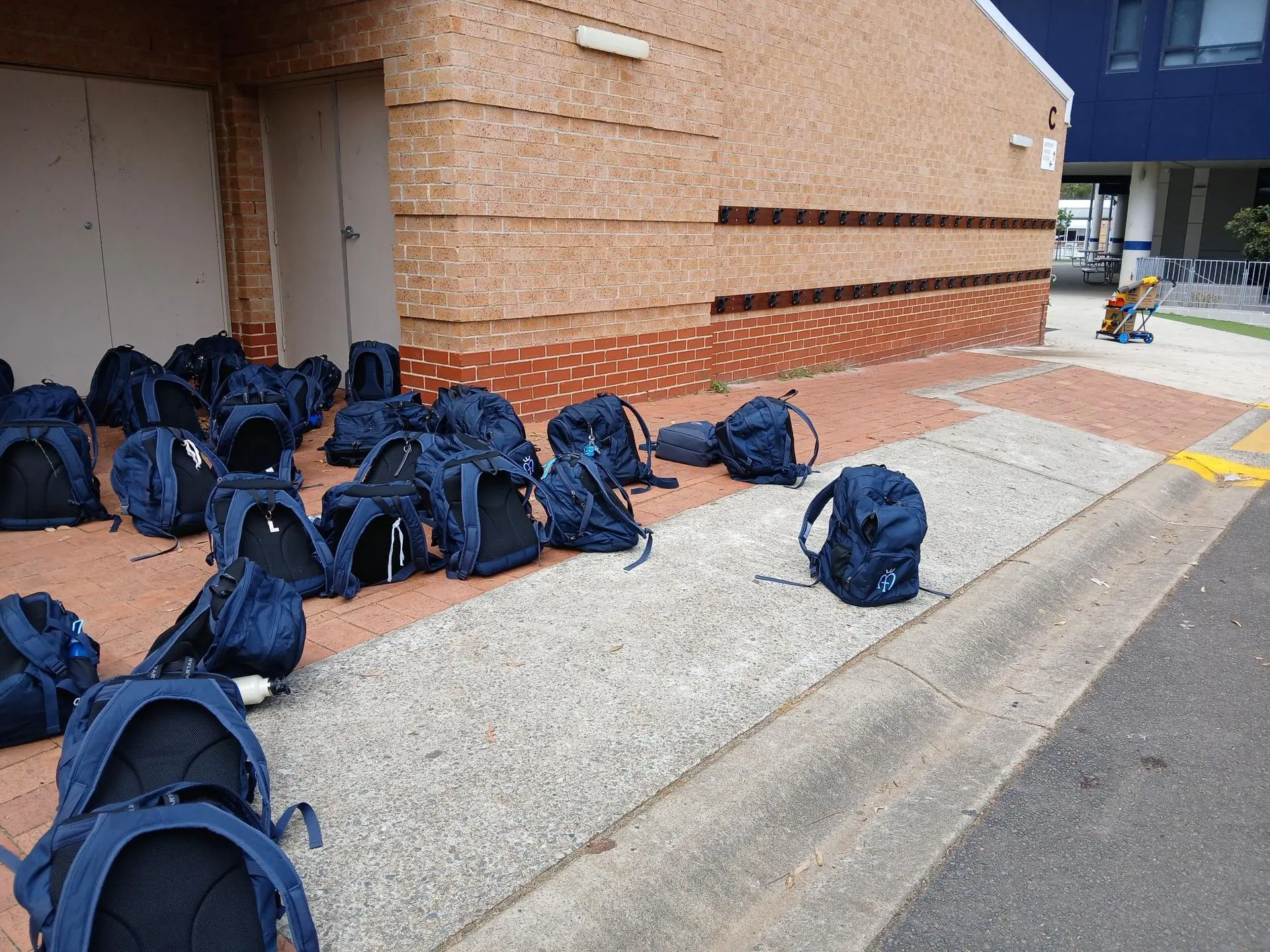 Scattered school bags causing trip hazards